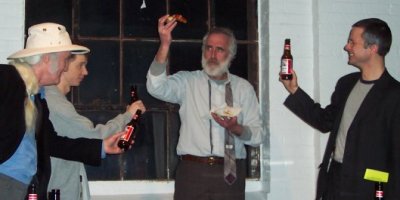 Joe Finneral, Andy Keefe, Mike Duffy, and Mike Benedetti celebrate with pizza and beer