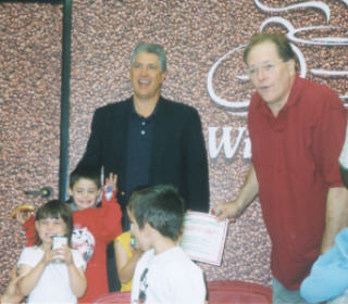 Bob Zanolli of Winchells Donuts with Dwight Smith of Isaiah House